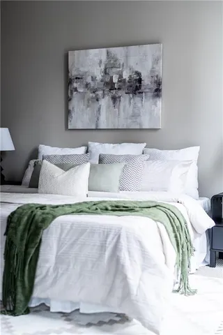 a bed room with a bed and a night stand