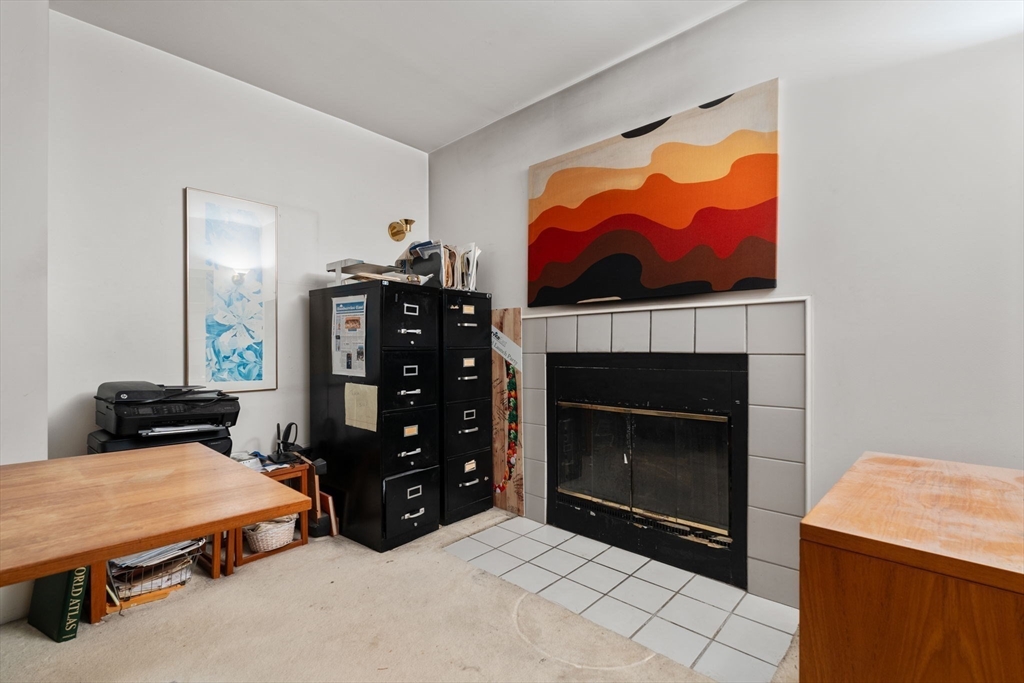 197 8th Street, Unit 728 Boston, MA 02129 - Photo 12 of 29 a room with furniture and a fireplace