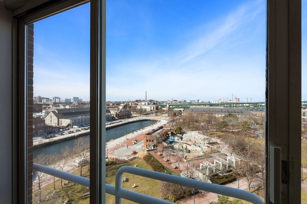 197 8th Street, Unit 728 Boston, MA 02129 - Photo 15 of 29 a view of a lake from a window