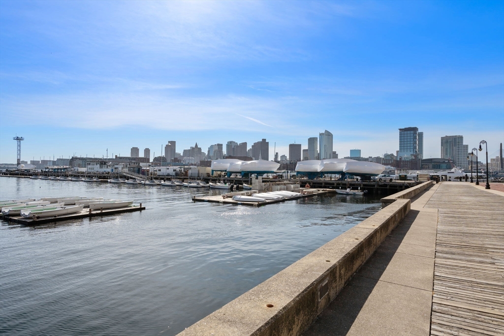 197 8th Street, Unit 728 Boston, MA 02129 - Photo 21 of 29 a view of swimming pool with outdoor seating and city view