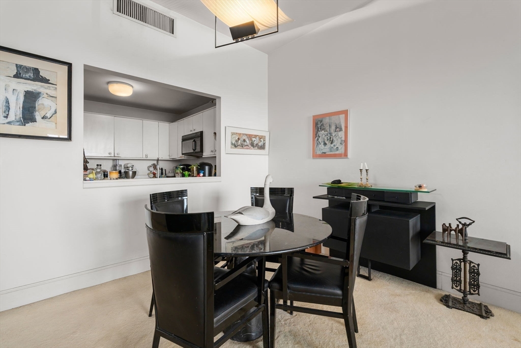 197 8th Street, Unit 728 Boston, MA 02129 - Photo 5 of 29 a view of a dining room with furniture
