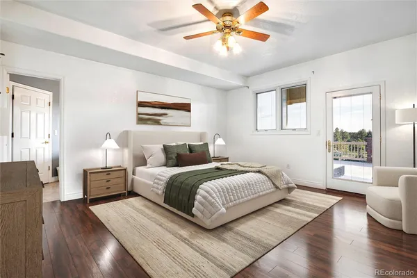 a bedroom with a large bed and a chandelier