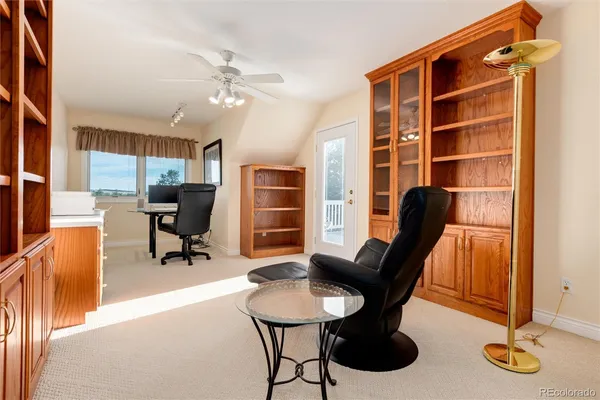 a view of a livingroom with furniture and a window