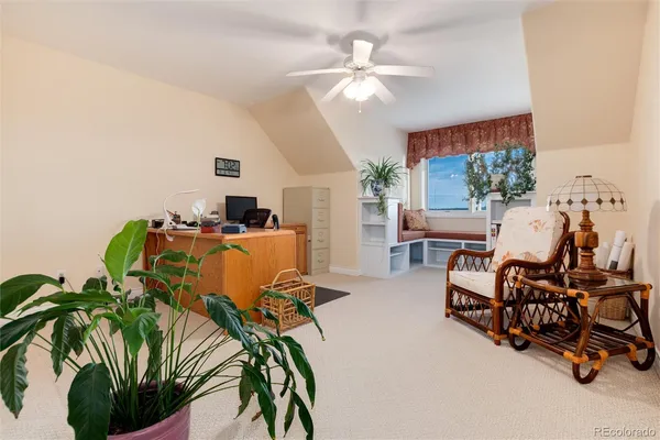 a view of a livingroom with furniture and a potted plant