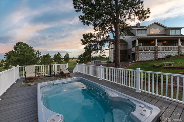 a view of a deck with a yard