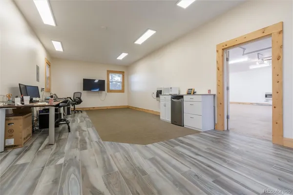a view of a kitchen with wooden floor