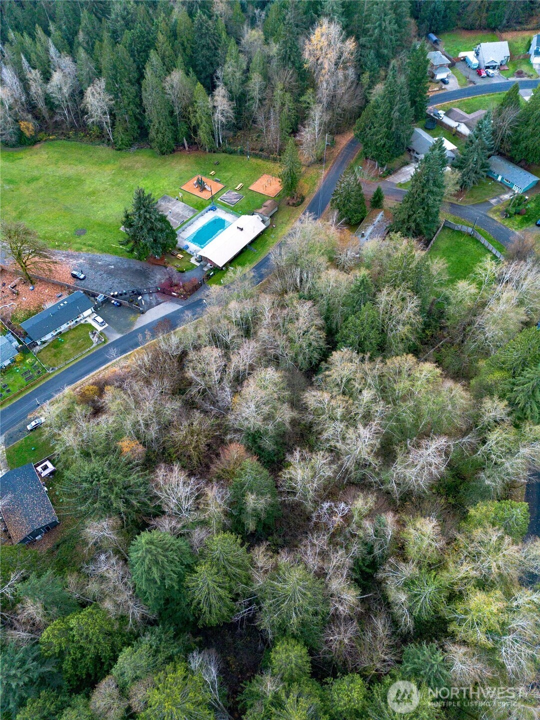 7609 Lakeside Street Southwest Olympia, WA 98512 - Photo 2 of 15 an aerial view of a house with a yard and lake view