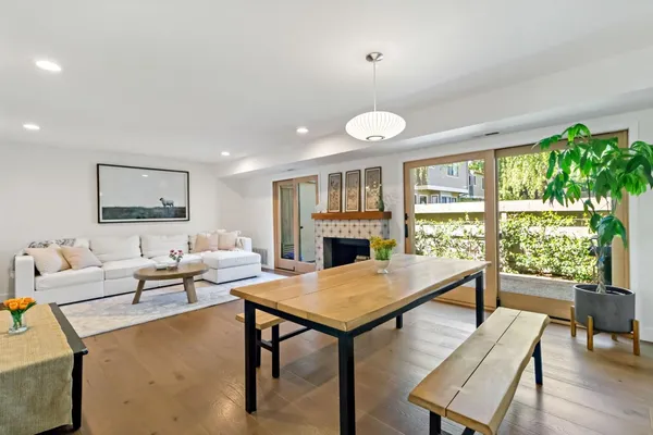 a living room with furniture a window and a kitchen