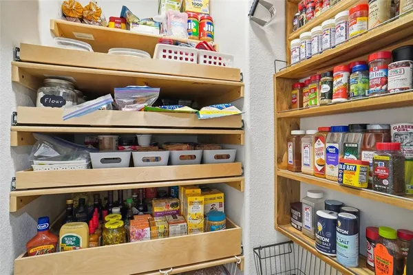 a kitchen that has a lot of cabinets in it