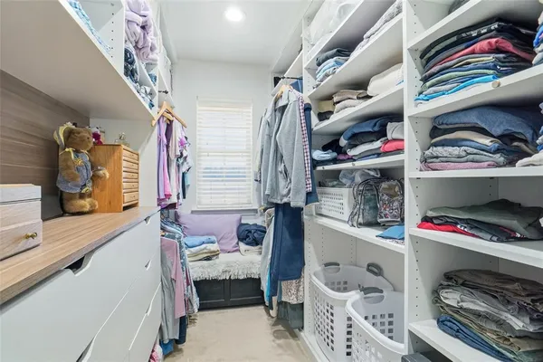 a view of storage and utility room with a sink