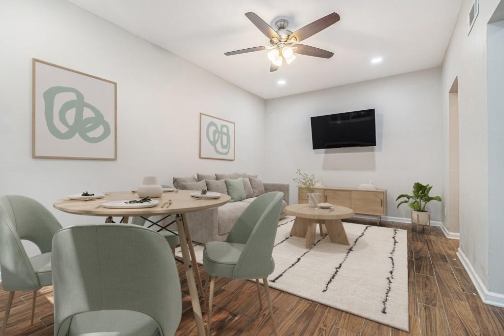 a view of a livingroom with furniture and a flat screen tv