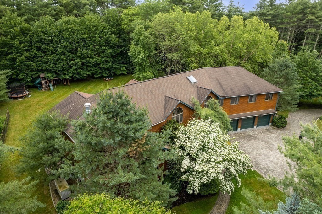 94 Topsfield Road Boxford, MA 01921 - Photo 4 of 40 an aerial view of a house with swimming pool and garden