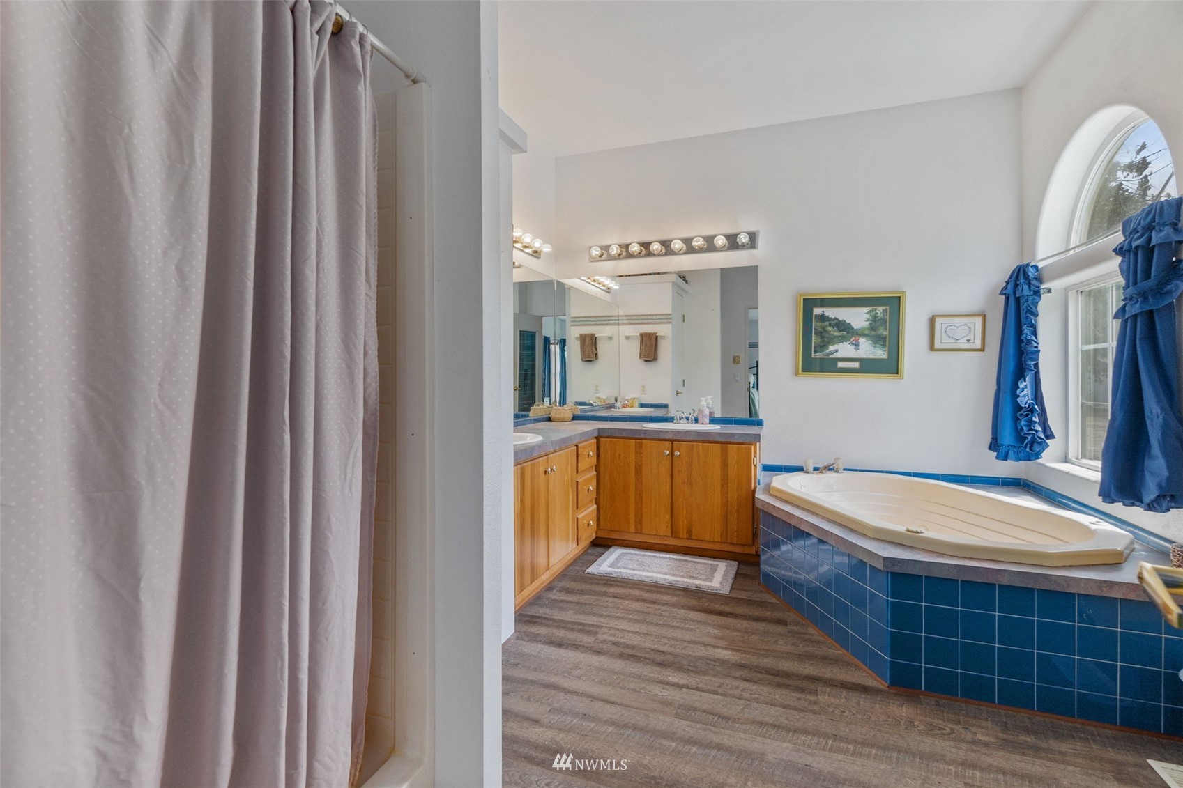 1153 Rush Road Chehalis, WA 98532 - Photo 22 of 30 a bathroom with a tub double vanity sink and mirror