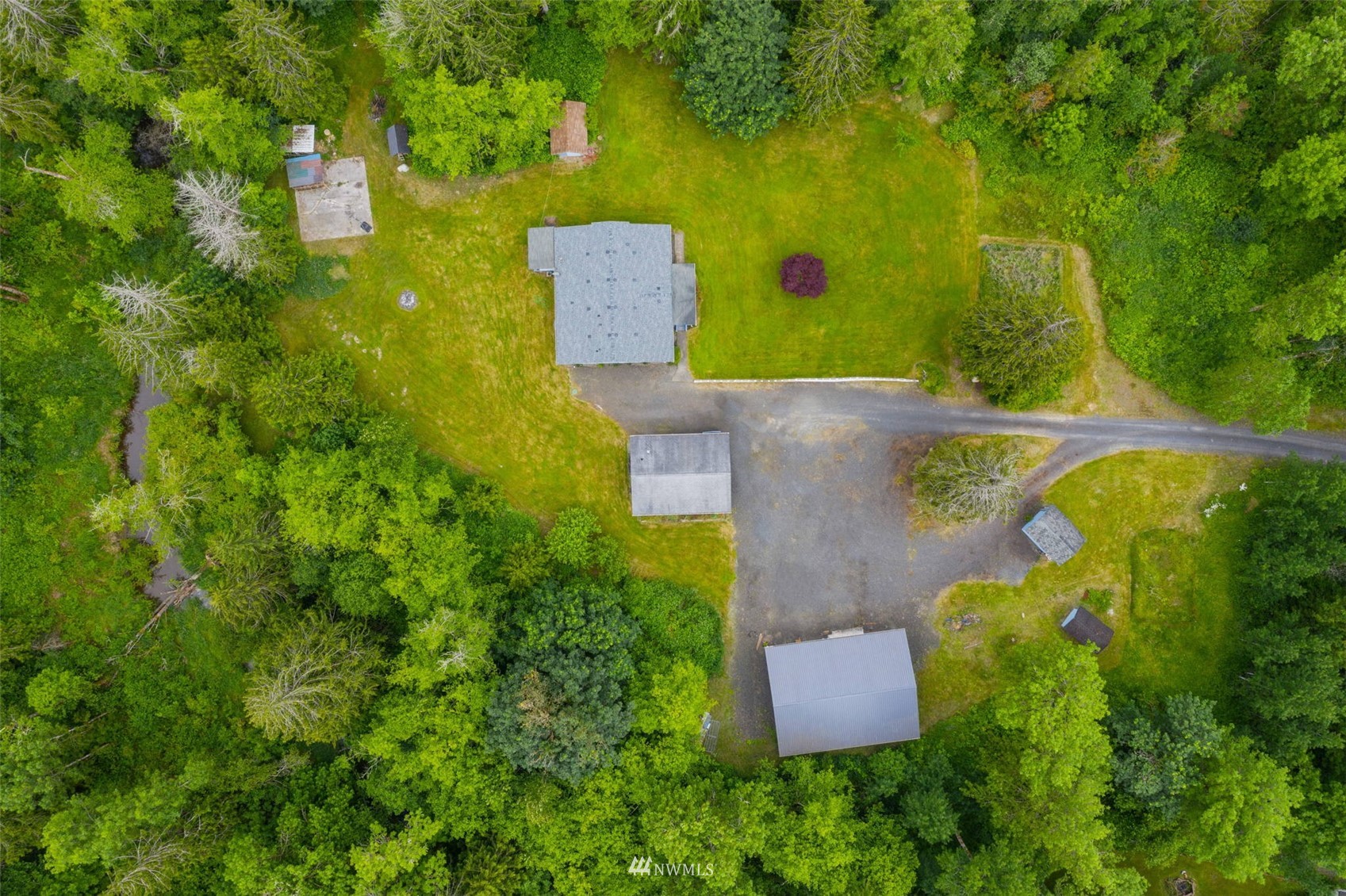 1153 Rush Road Chehalis, WA 98532 - Photo 3 of 30 an aerial view of a house with a yard and lake view
