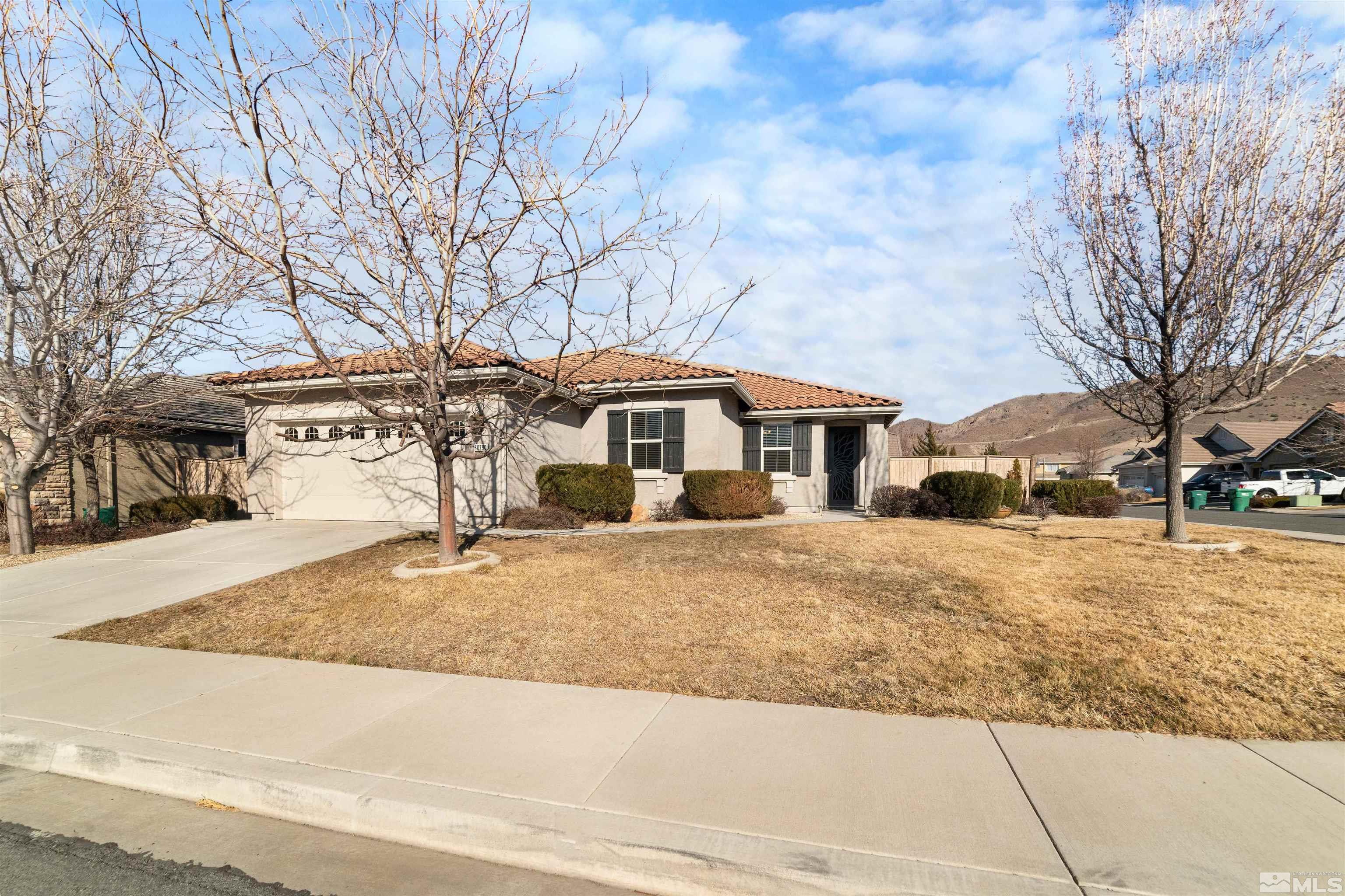 10790 Cedar Rock Drive Reno, NV 89521 - Photo 1 of 34 a front view of a house with a yard