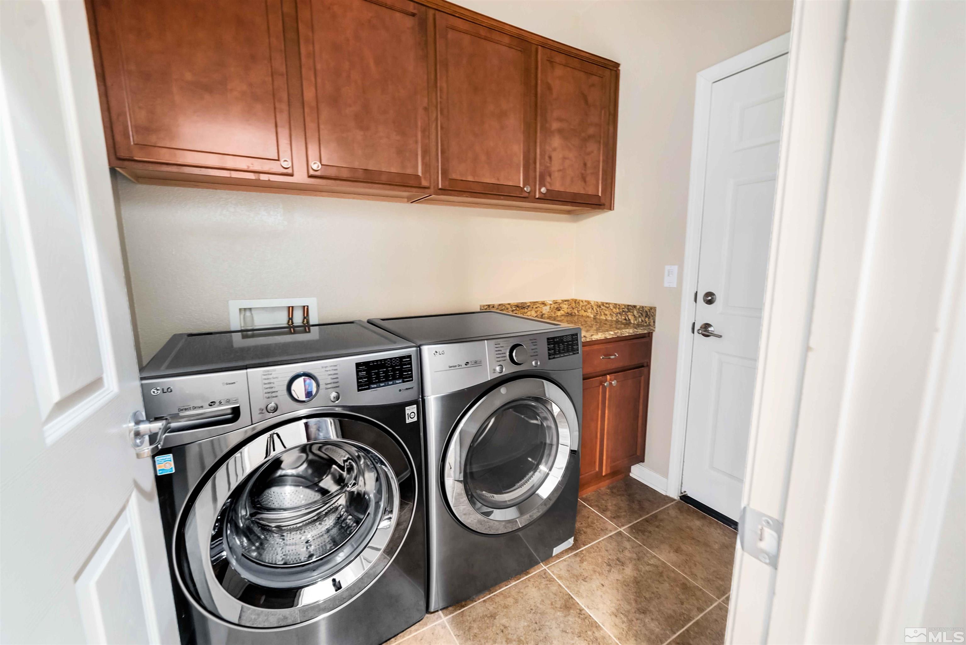 10790 Cedar Rock Drive Reno, NV 89521 - Photo 17 of 34 a utility room with dryer and washer