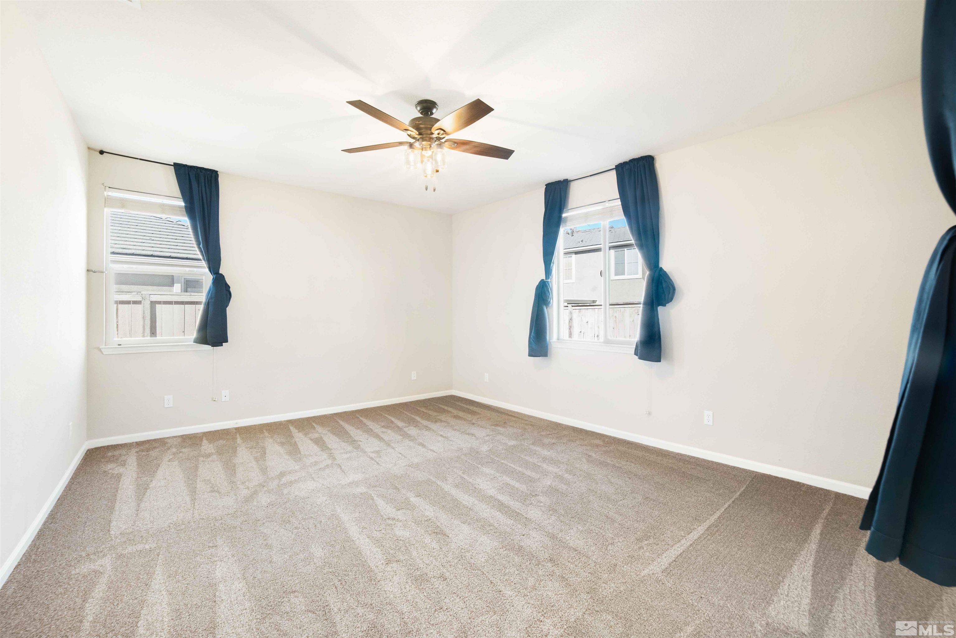 10790 Cedar Rock Drive Reno, NV 89521 - Photo 20 of 34 an empty room with windows and fan