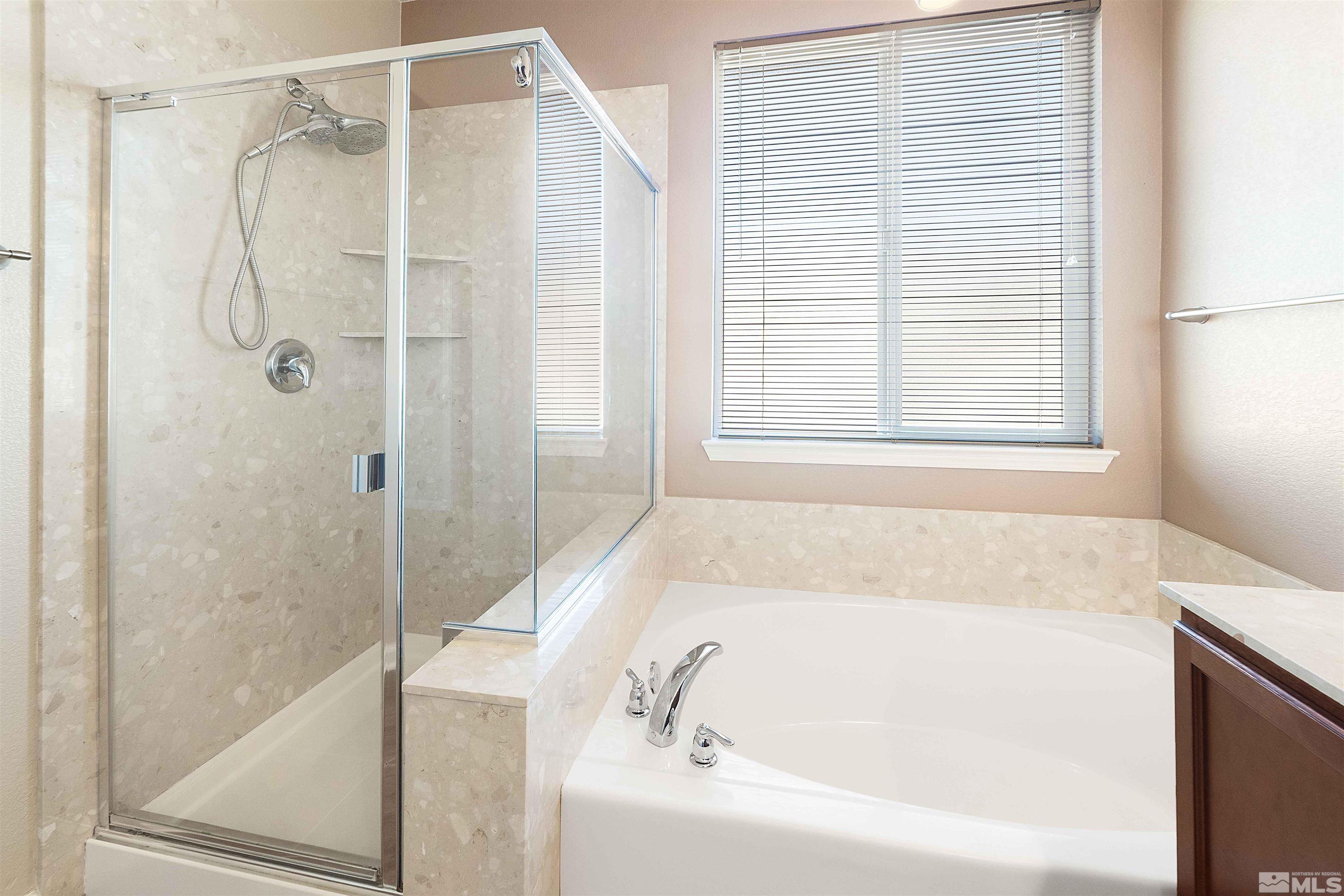 10790 Cedar Rock Drive Reno, NV 89521 - Photo 24 of 34 a white bath tub sitting next to a shower