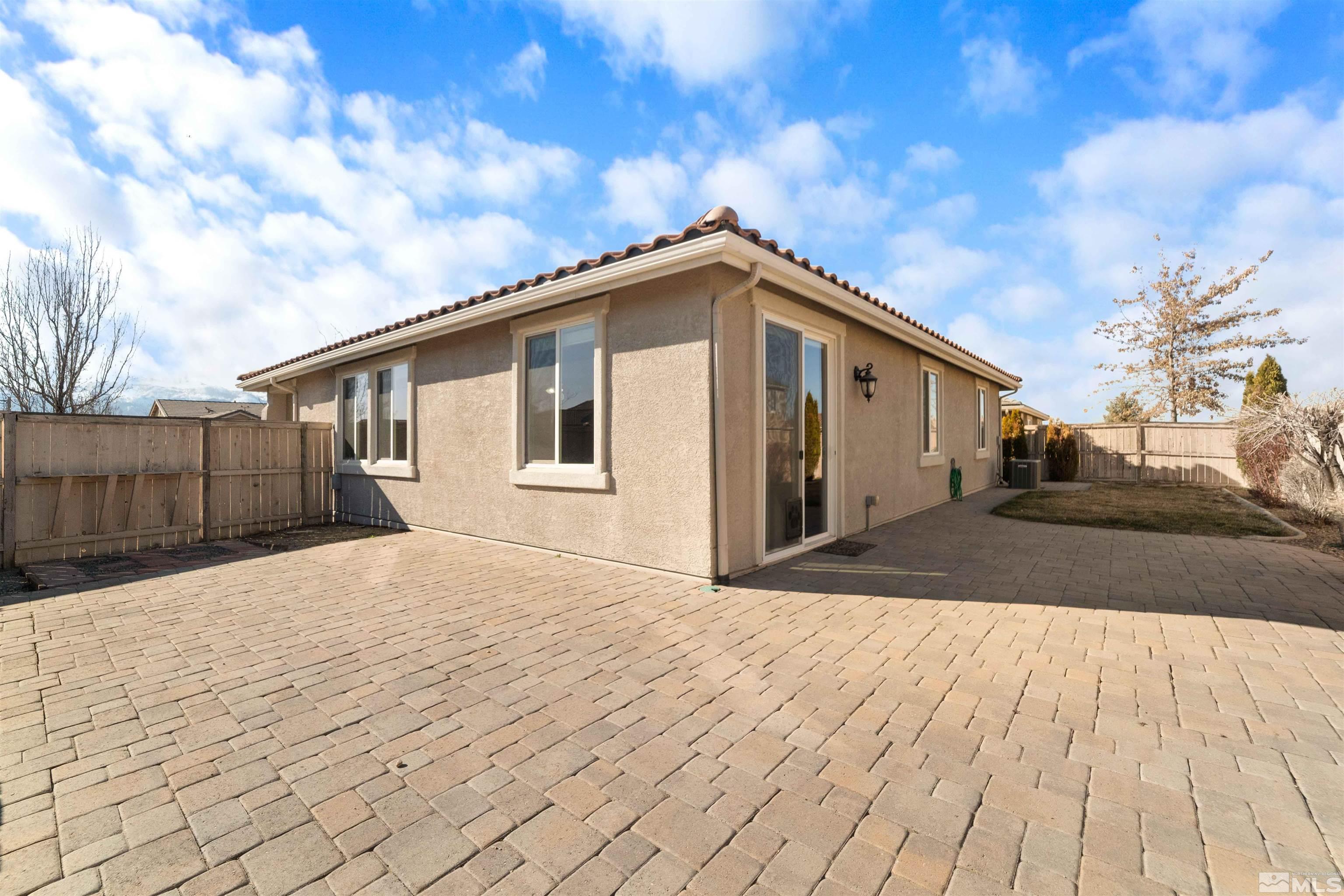 10790 Cedar Rock Drive Reno, NV 89521 - Photo 27 of 34 a front view of a house with a yard