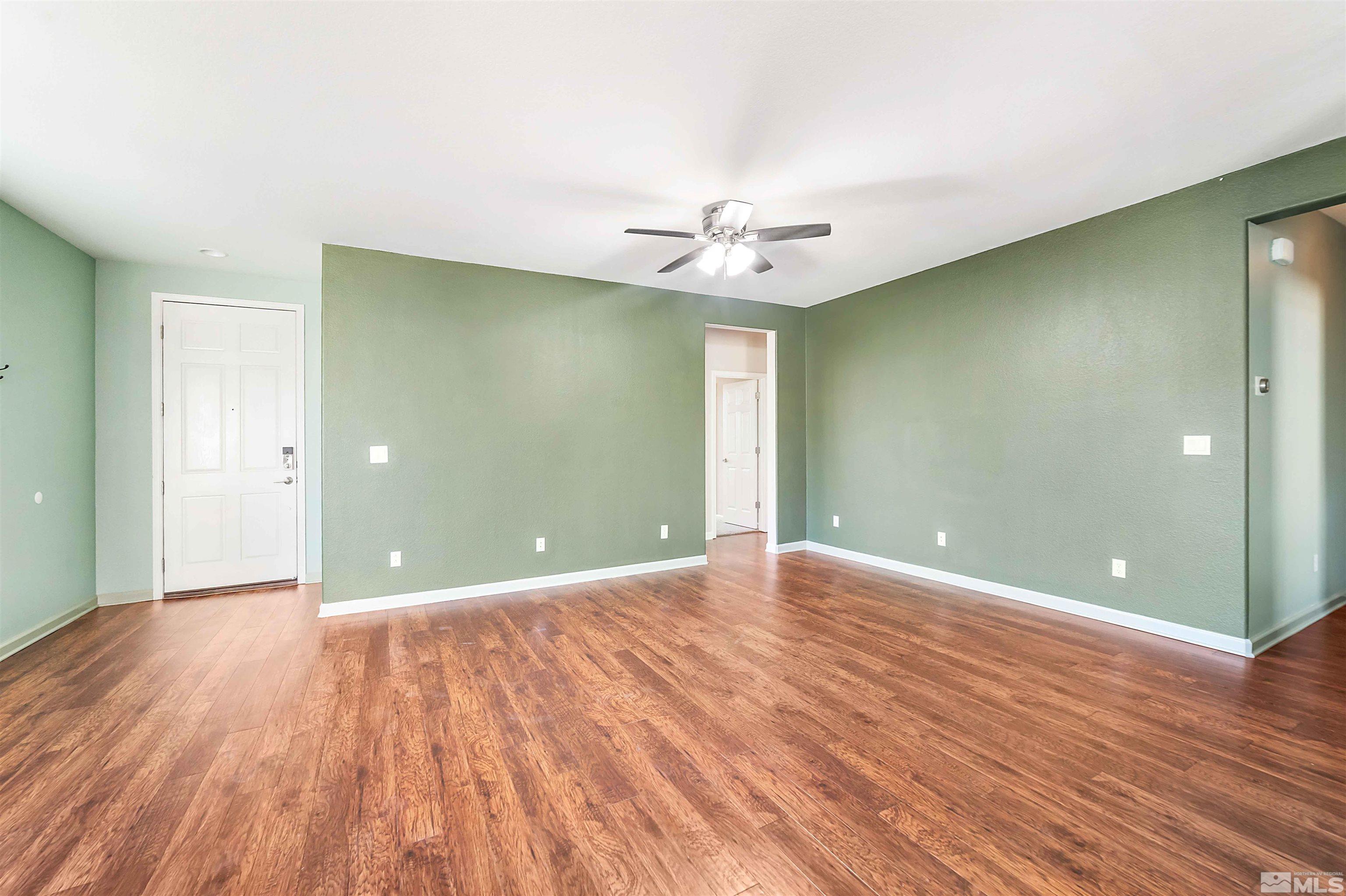 10790 Cedar Rock Drive Reno, NV 89521 - Photo 5 of 34 a view of an empty room with wooden floor