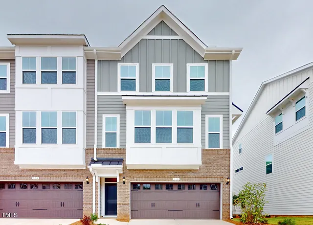 a view of a brick building with many windows