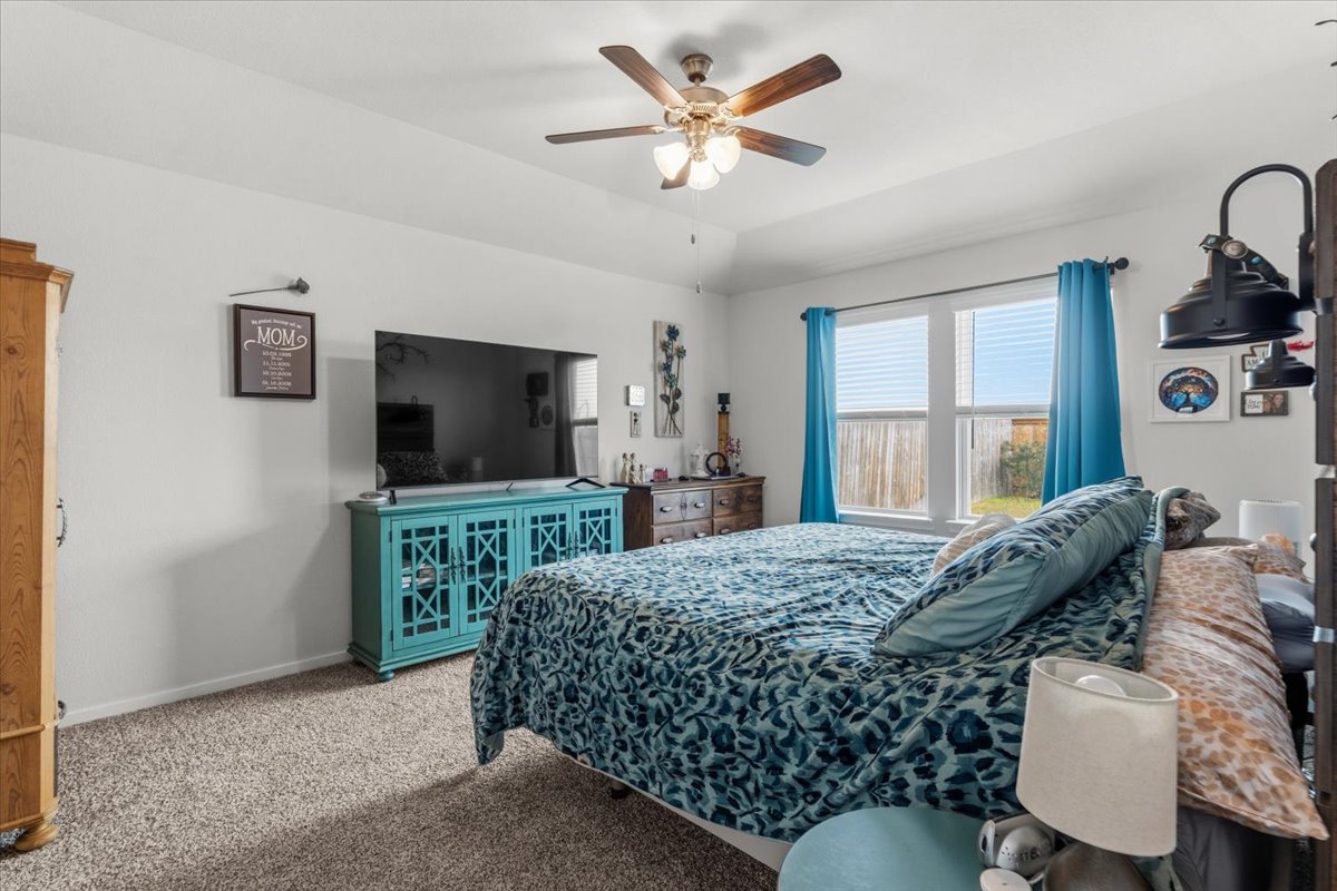 402 Perry Place Rockdale, TX 76567 - Photo 12 of 31 Carpeted bedroom with ceiling fan and lofted ceiling
