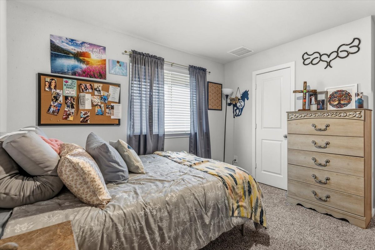 402 Perry Place Rockdale, TX 76567 - Photo 24 of 31 View of carpeted bedroom