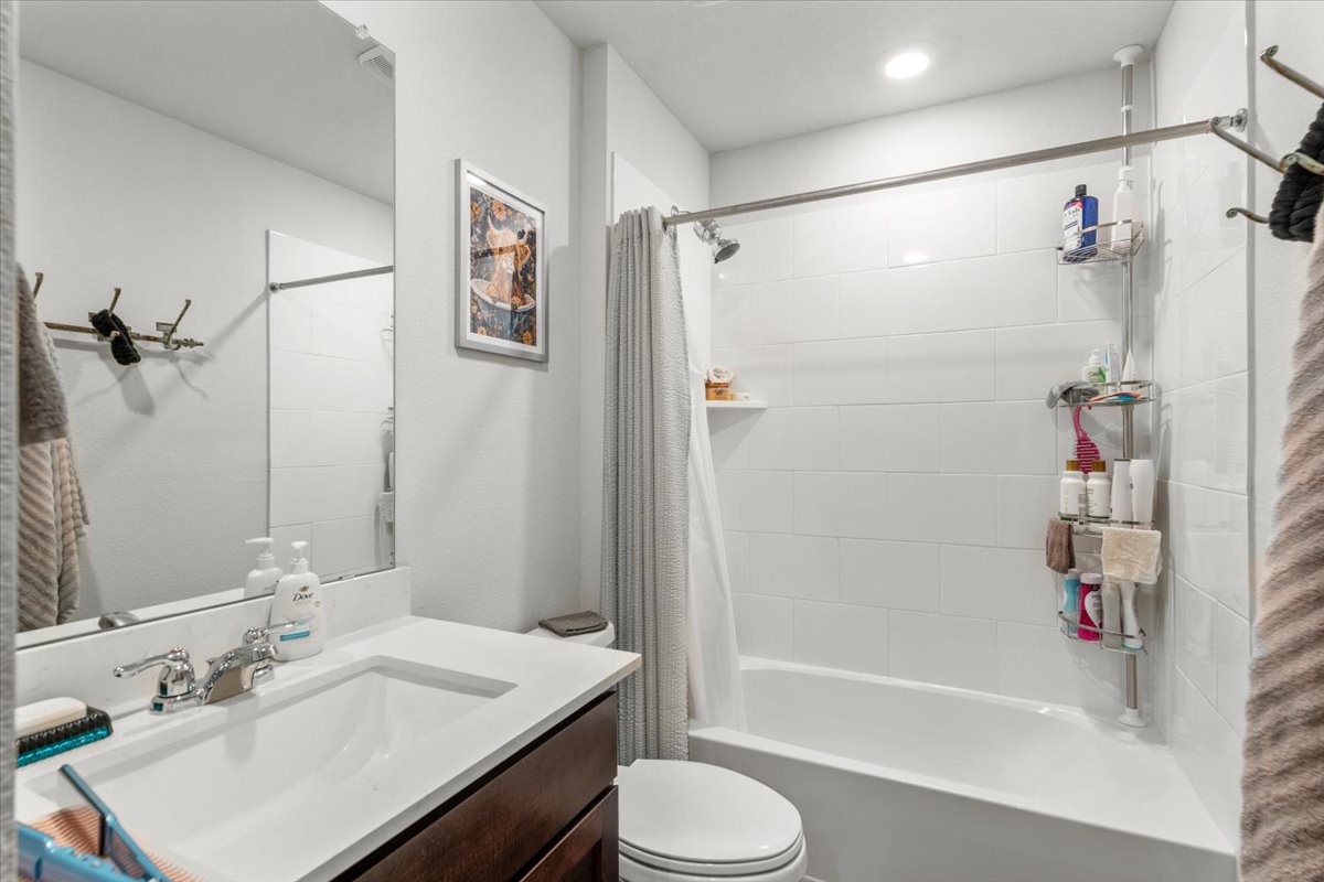 402 Perry Place Rockdale, TX 76567 - Photo 26 of 31 Full bath with vanity and shower / bathtub combination with curtain