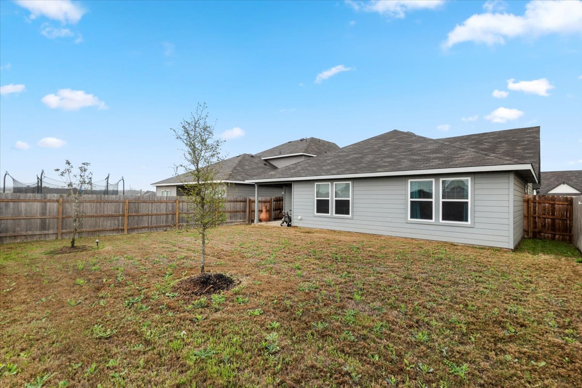 402 Perry Place Rockdale, TX 76567 - Photo 30 of 31 Rear view of house with a fenced backyard