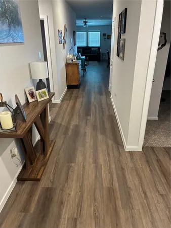 a view of a workspace with wooden floor and staircase