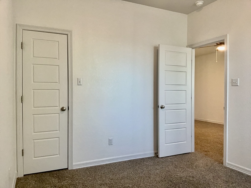 18005 Pomelo Lane, Unit A Pflugerville, TX 78660 - Photo 20 of 28 an empty room with closet area
