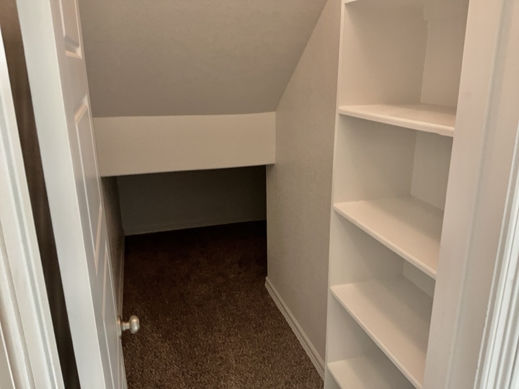 18005 Pomelo Lane, Unit A Pflugerville, TX 78660 - Photo 26 of 28 a hallway with two window
