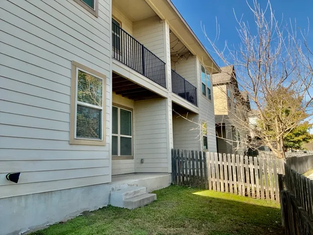 a view of a chair and table in the garden