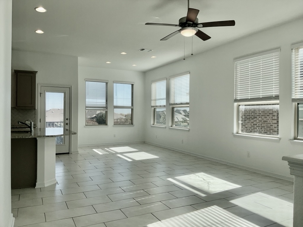 18005 Pomelo Lane, Unit A Pflugerville, TX 78660 - Photo 4 of 28 a view of livingroom with hardwood floor and a ceiling fan