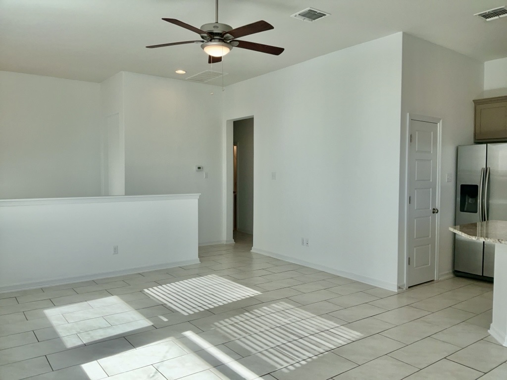 18005 Pomelo Lane, Unit A Pflugerville, TX 78660 - Photo 5 of 28 a view of an empty room