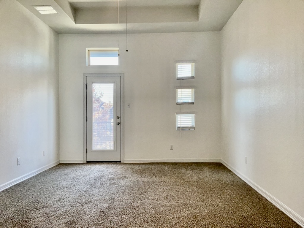 18005 Pomelo Lane, Unit A Pflugerville, TX 78660 - Photo 10 of 28 an empty room with windows