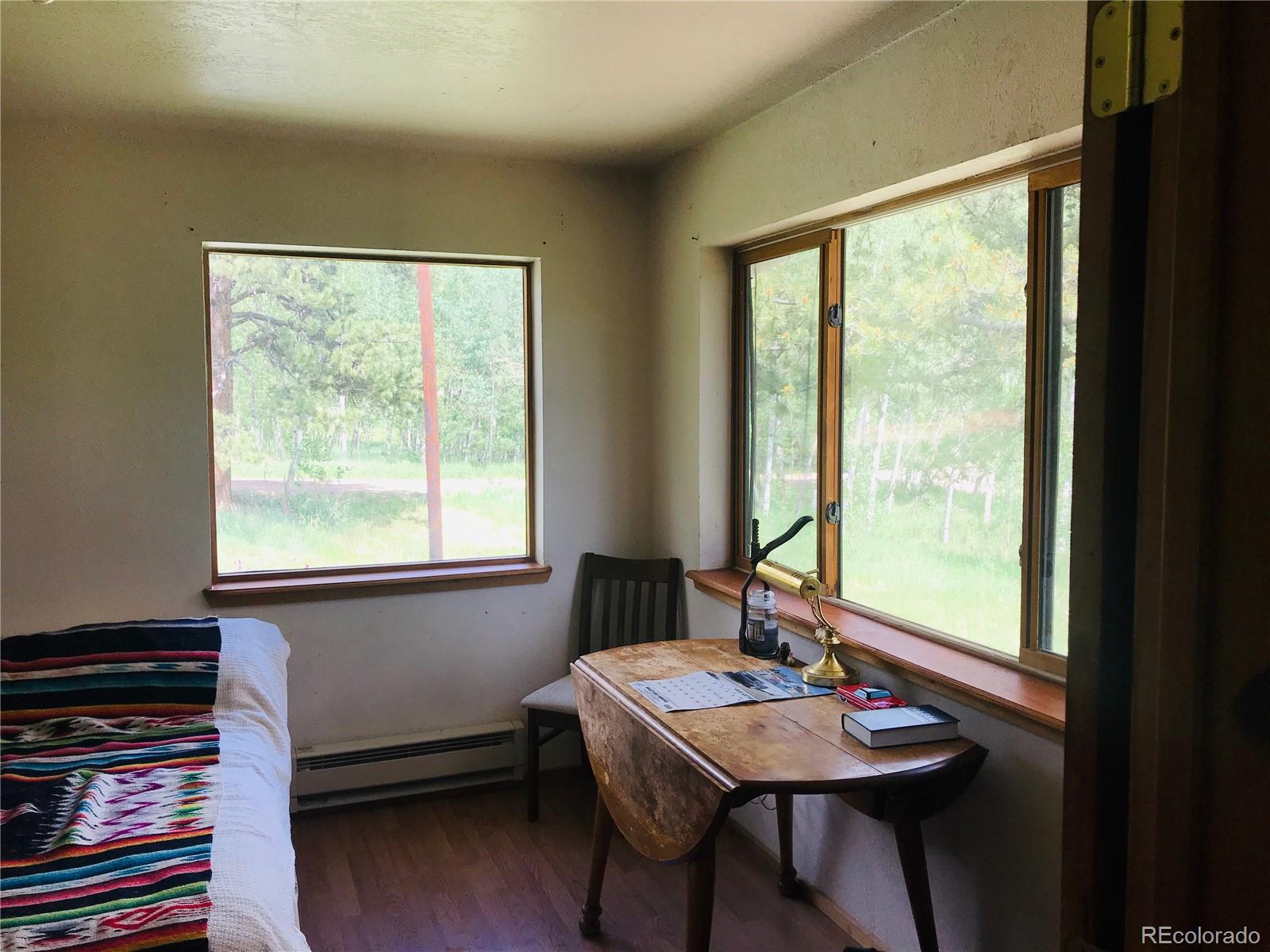 538 Neal Road Bailey, CO 80421 - Photo 14 of 20 a view of a workspace with a window