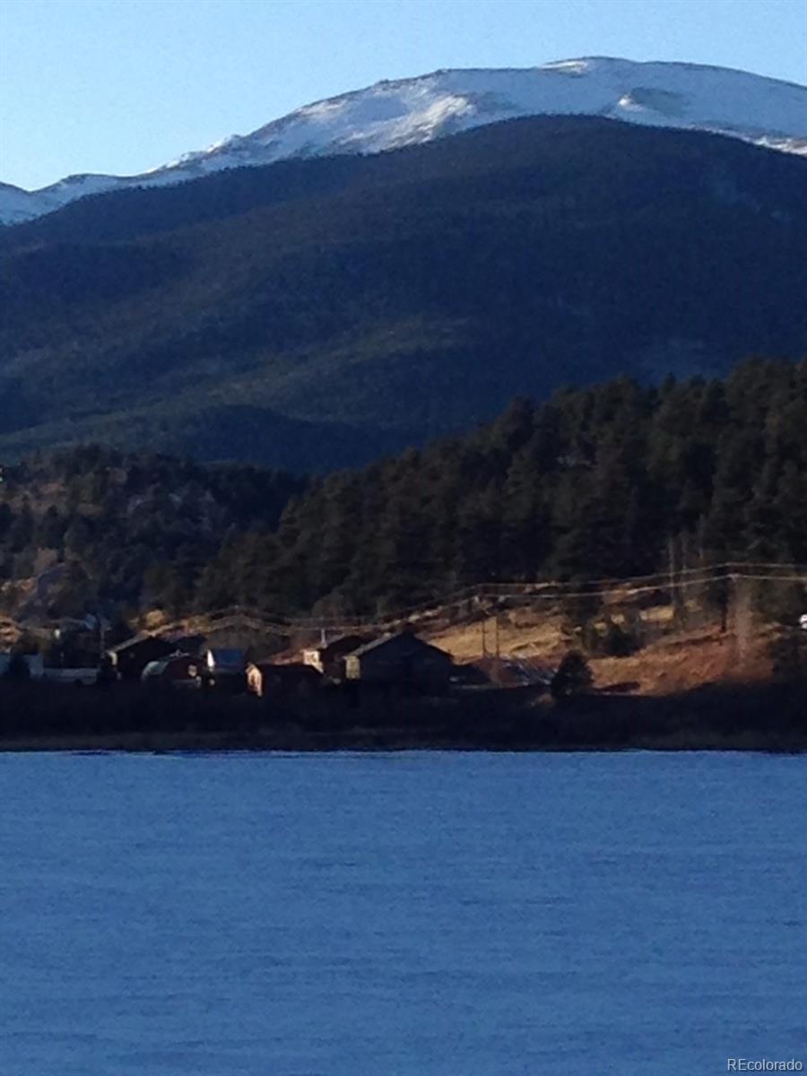 538 Neal Road Bailey, CO 80421 - Photo 19 of 20 a view of a lake in middle of forest