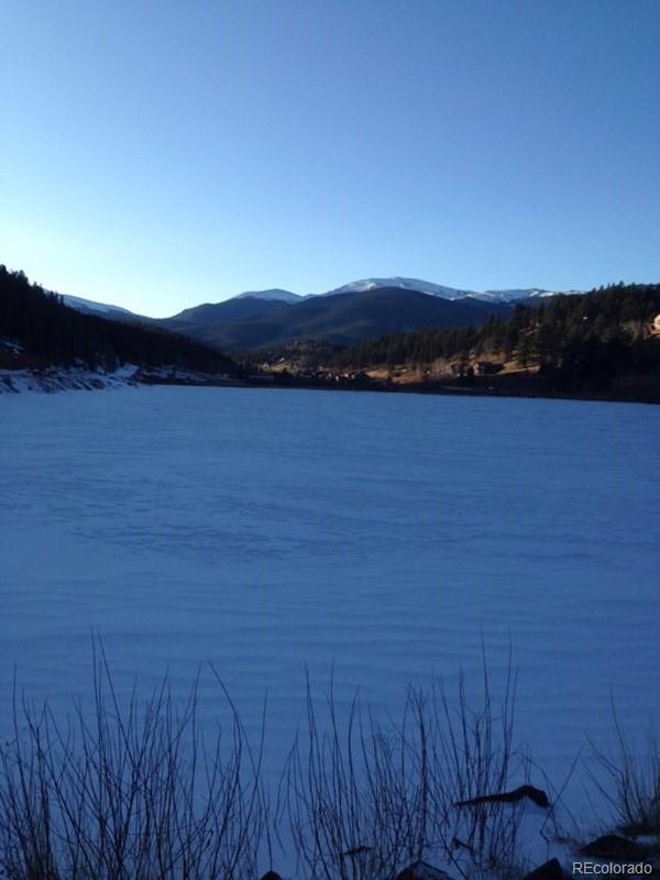 538 Neal Road Bailey, CO 80421 - Photo 20 of 20 a view of lake and sunset