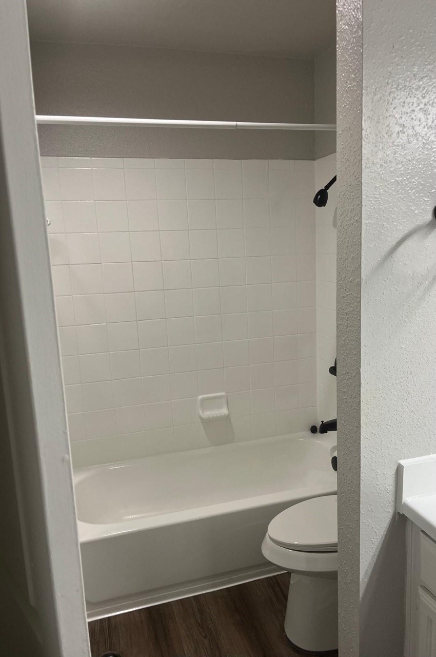 9255 West Sam Houston Parkway South, Unit 407 Houston, TX 77036 - Photo 2 of 10 a bathroom with a shower a toilet and a shower