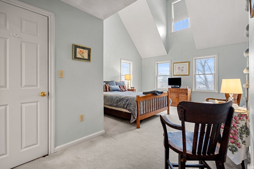 28 Coleman Road Groveland, MA 01834 - Photo 18 of 37 a living room with furniture and a flat screen tv