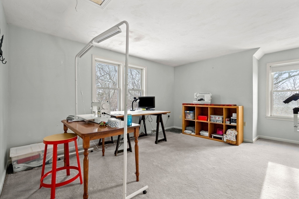 28 Coleman Road Groveland, MA 01834 - Photo 24 of 37 a living room with furniture and a flat screen tv