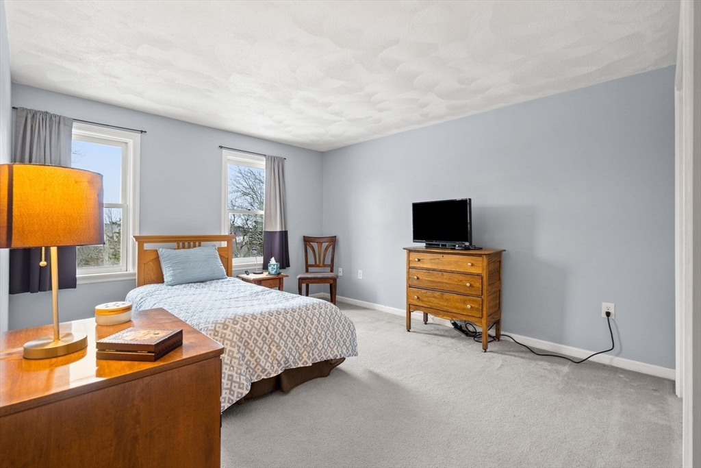 28 Coleman Road Groveland, MA 01834 - Photo 26 of 37 a bedroom with a bed and flat screen tv