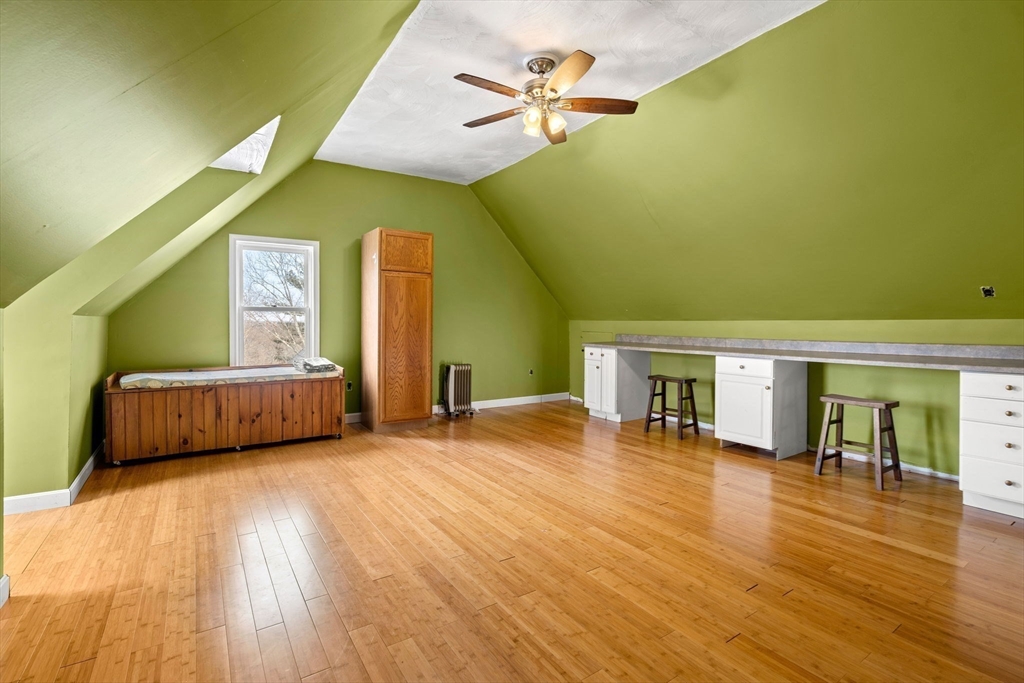28 Coleman Road Groveland, MA 01834 - Photo 34 of 37 a living room with furniture and a wooden floor