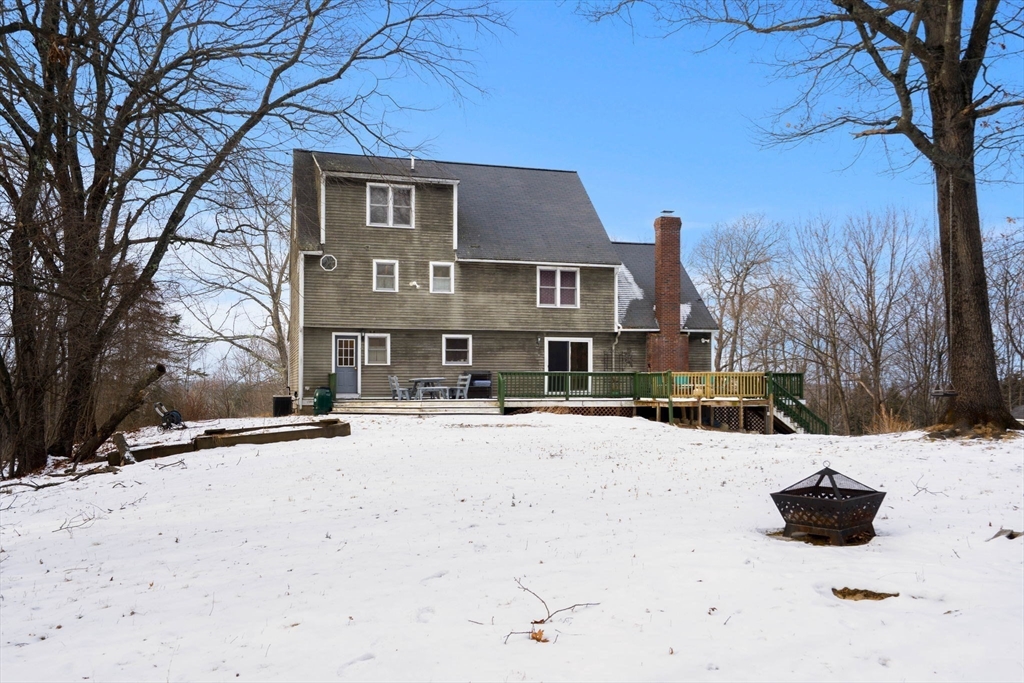 28 Coleman Road Groveland, MA 01834 - Photo 36 of 37 a front view of a house with a yard covered in snow