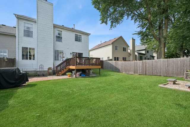 a car parked in front of a house with a yard