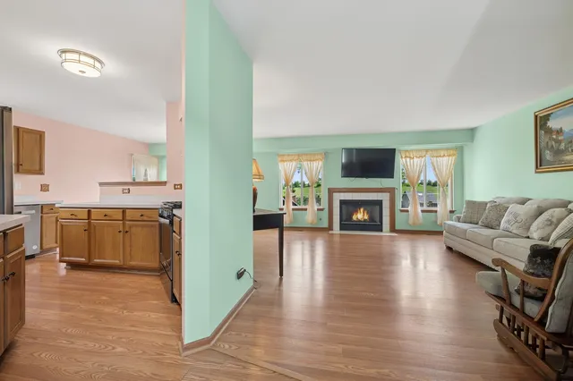 a view of kitchen with furniture and wooden floor