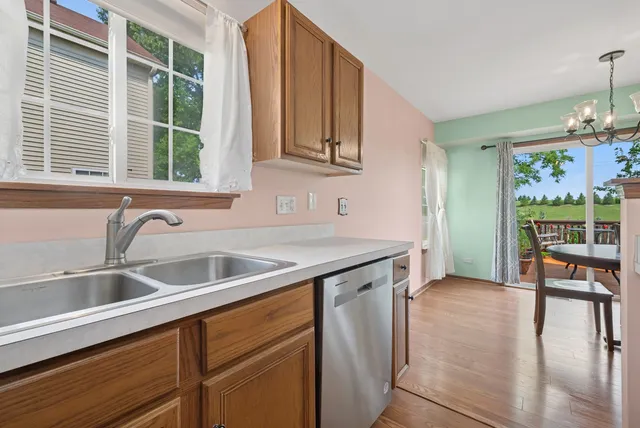 a kitchen with a sink and a large window