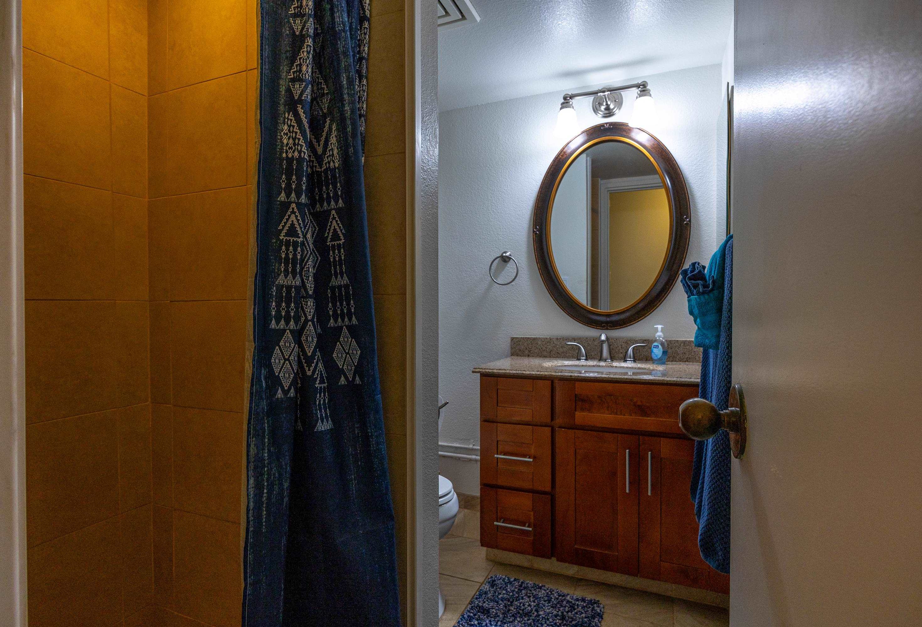 2695 South Kihei Road, Unit 9209 Kihei, HI 96753 - Photo 21 of 50 a bathroom with a sink and a mirror