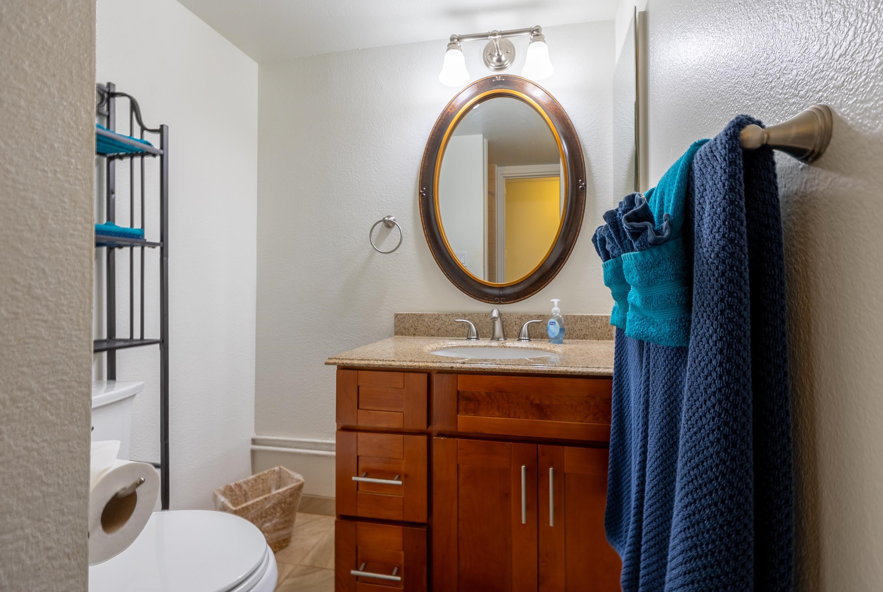 2695 South Kihei Road, Unit 9209 Kihei, HI 96753 - Photo 22 of 50 a bathroom with a toilet a sink and a mirror
